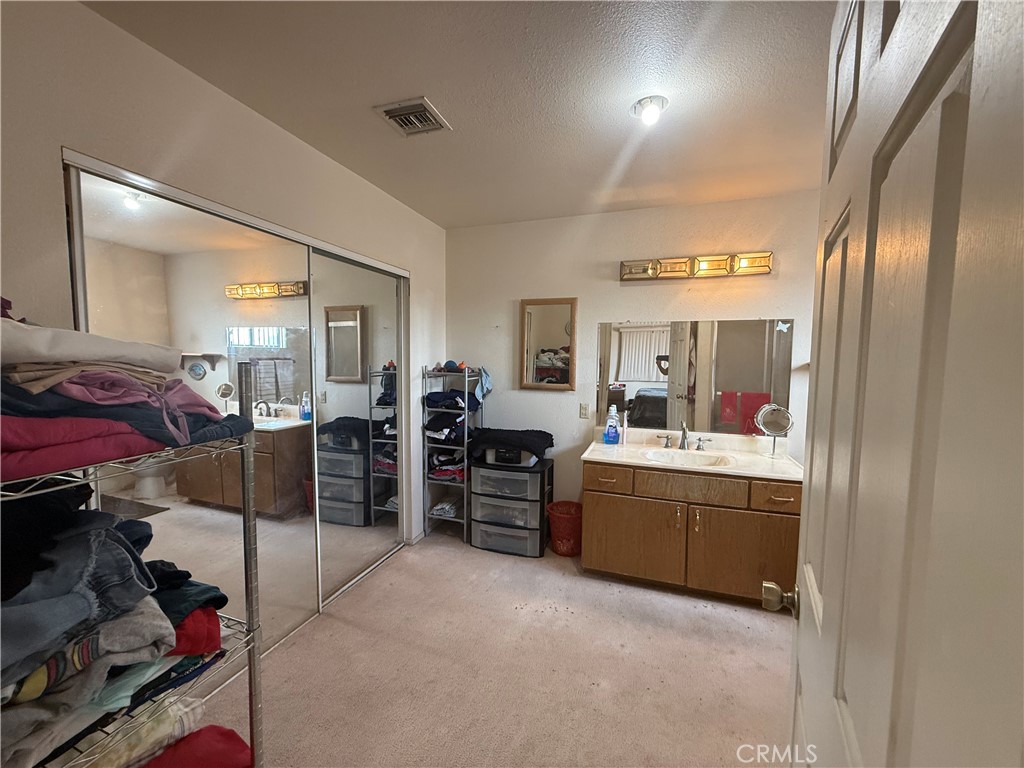 151080 Deerpath Road Big River, CA 92242 - Photo 14 of 24 a room with furniture and a flat screen tv