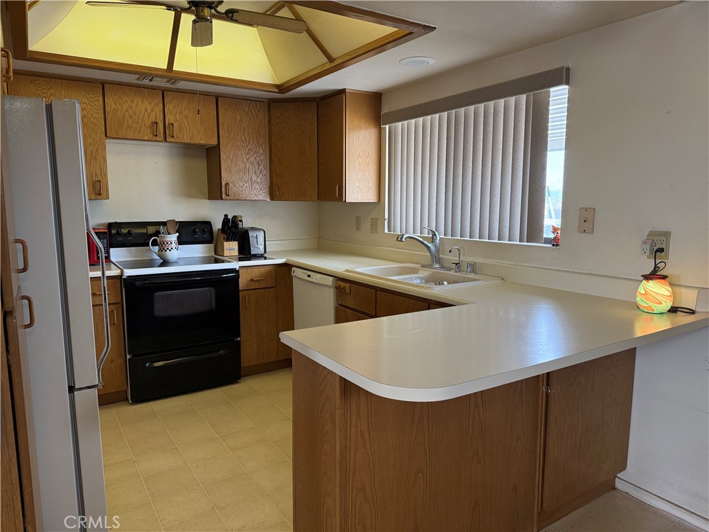 151080 Deerpath Road Big River, CA 92242 - Photo 5 of 24 a kitchen with a sink a stove and cabinets