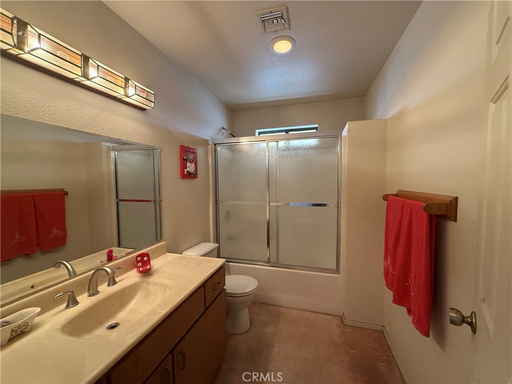 151080 Deerpath Road Big River, CA 92242 - Photo 8 of 24 a bathroom with a double vanity sink mirror and shower