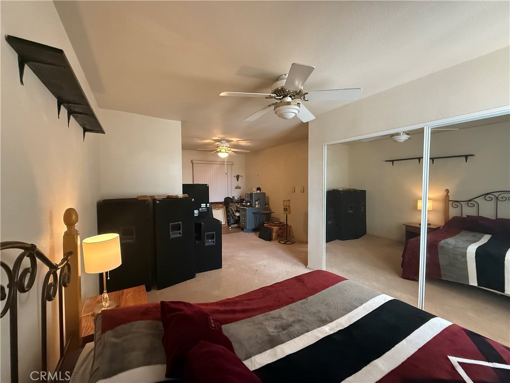 151080 Deerpath Road Big River, CA 92242 - Photo 10 of 24 a living room with furniture and a rug