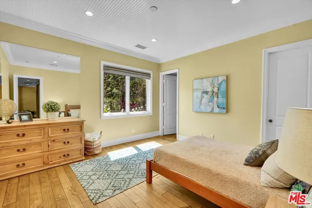 a view of backyard with swimming pool and seating space