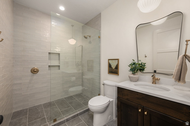 4871 South Homestead Way Washington, UT 84780 - Photo 87 of 151 Full bath with vanity, a walk in shower, dark tile patterned flooring, and recessed lighting