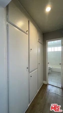 a bathroom with a shower and a glass door