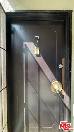 a bathroom with a light fixture and a glass door