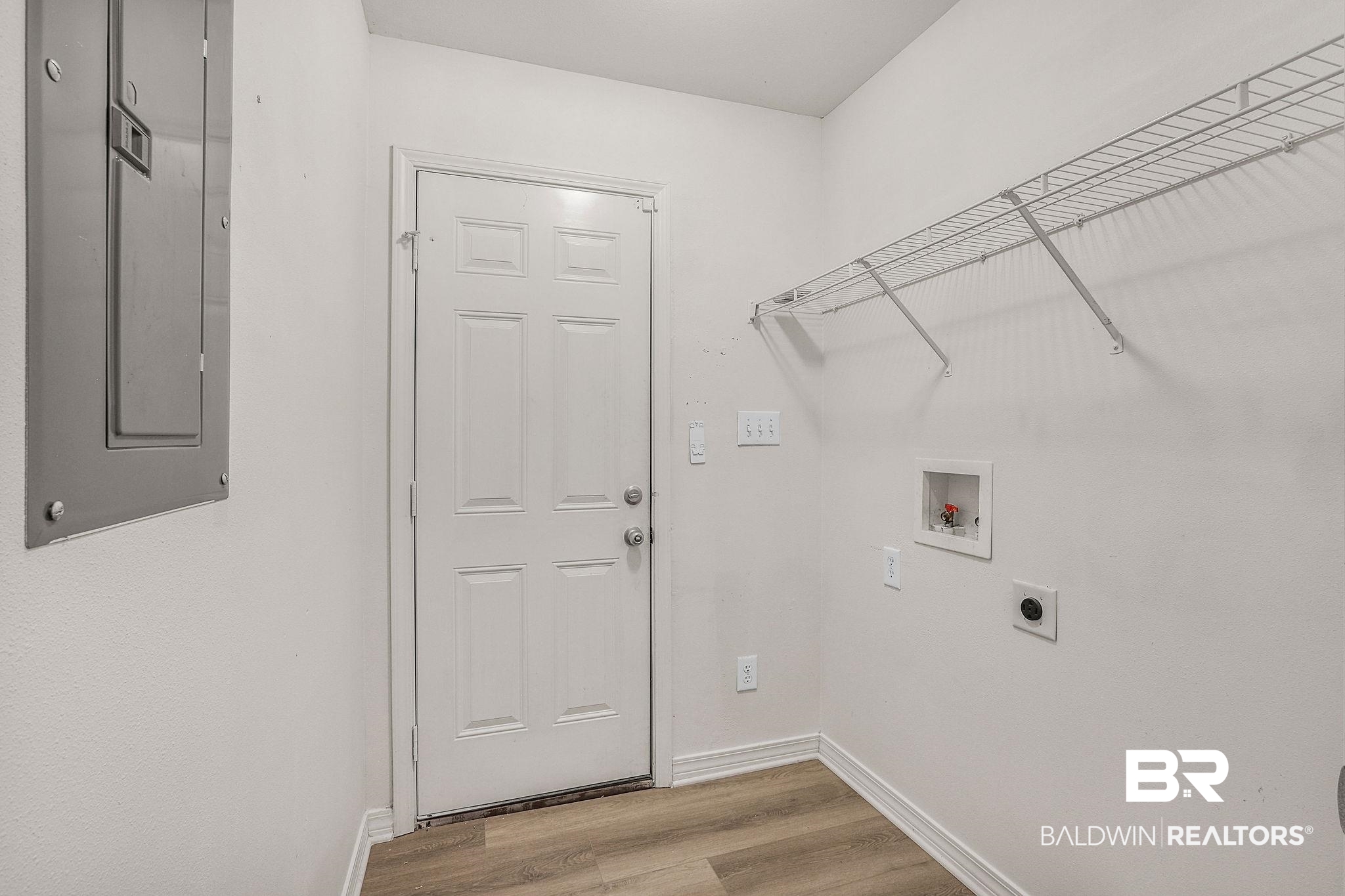 18620 Hammond Street Robertsdale, AL 36567 - Photo 15 of 23 Laundry area featuring washer hookup, electric panel, hookup for an electric dryer, and light hardwood / wood-style flooring