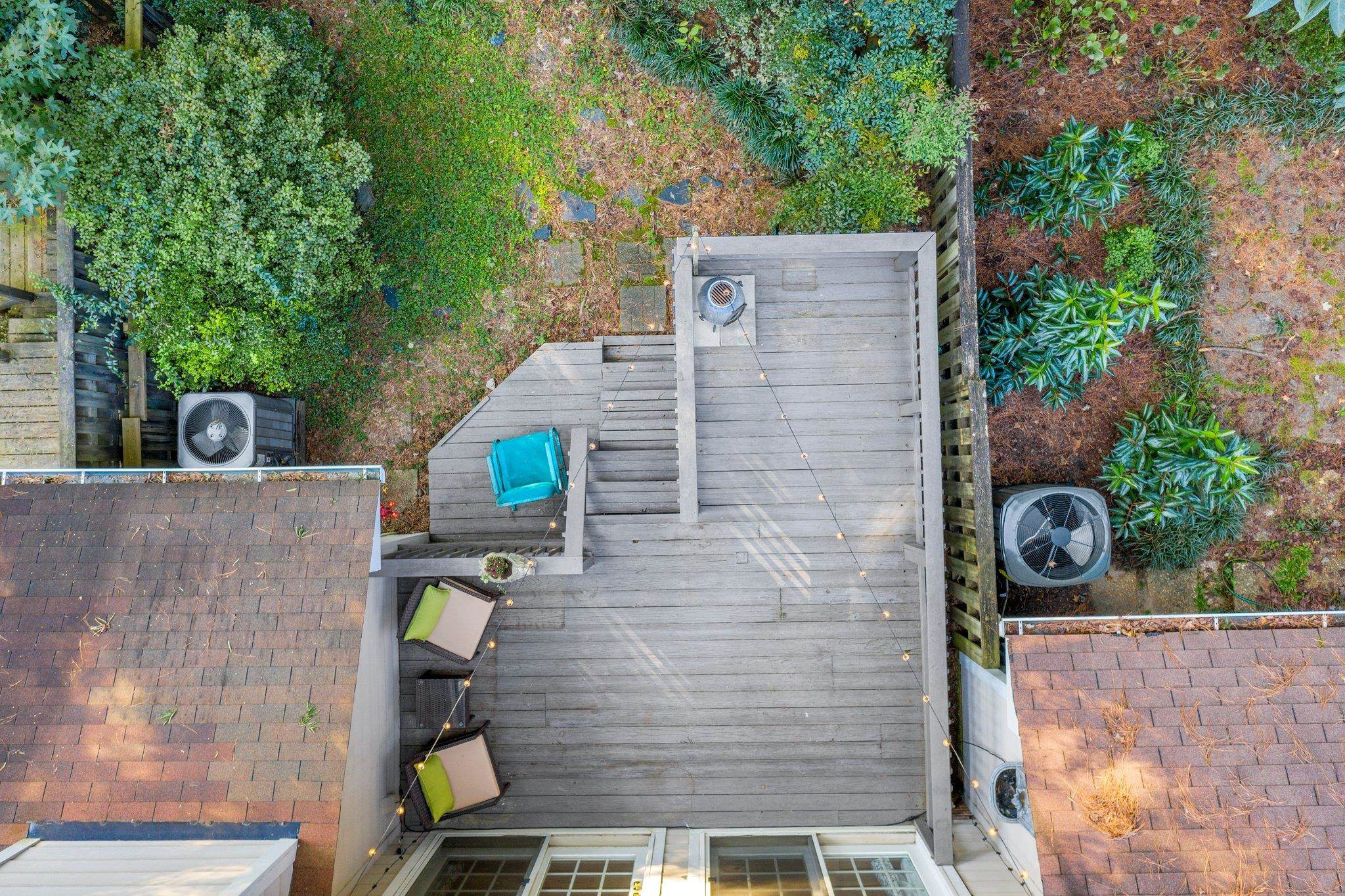 1502 Edgeside Court Raleigh, NC 27609 - Photo 22 of 27 Aerial view of the townhouse to see fenced in backyard backing to woods for more privacy. Aerial View