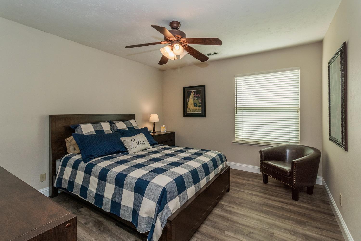 6233 South Armstrong Avenue Fowler, CA 93625 - Photo 19 of 30 a bedroom with a bed and a couch