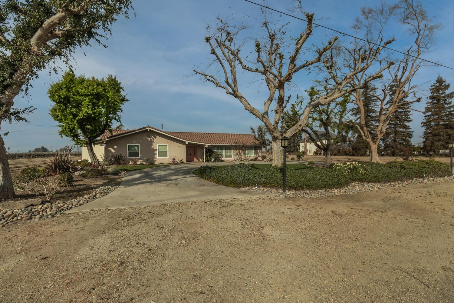 6233 South Armstrong Avenue Fowler, CA 93625 - Photo 2 of 30 a front view of a house with a yard