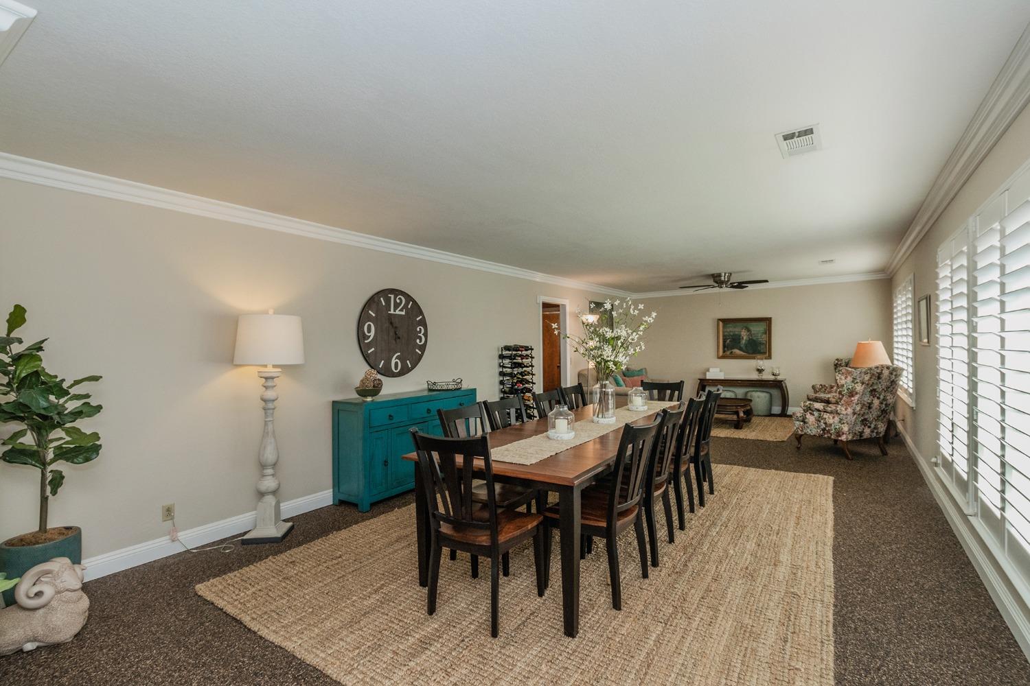 6233 South Armstrong Avenue Fowler, CA 93625 - Photo 3 of 30 a view of a dining room with furniture and wooden floor