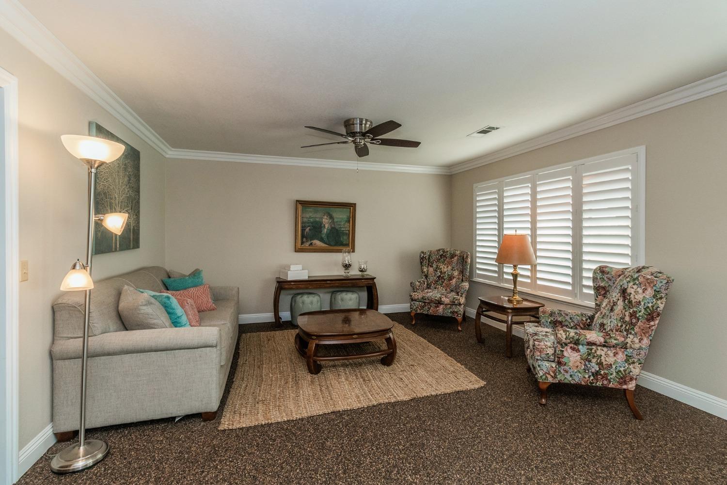 6233 South Armstrong Avenue Fowler, CA 93625 - Photo 5 of 30 a living room with furniture and a window