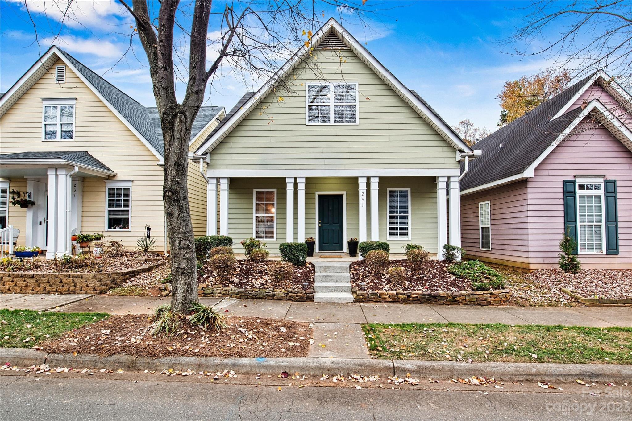 a front view of a house with garden