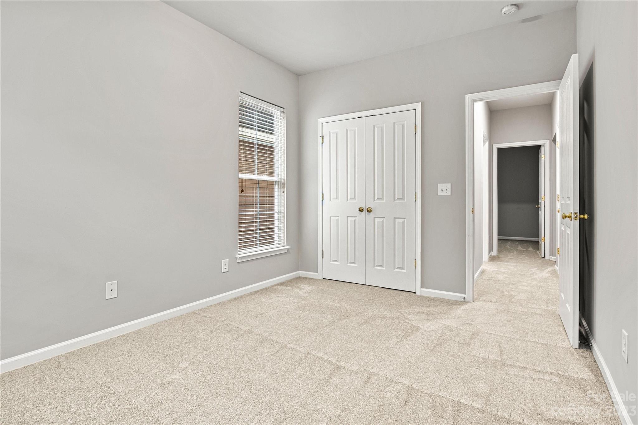 241 Faust Road Davidson, NC 28036 - Photo 21 of 29 an empty room with windows and closet