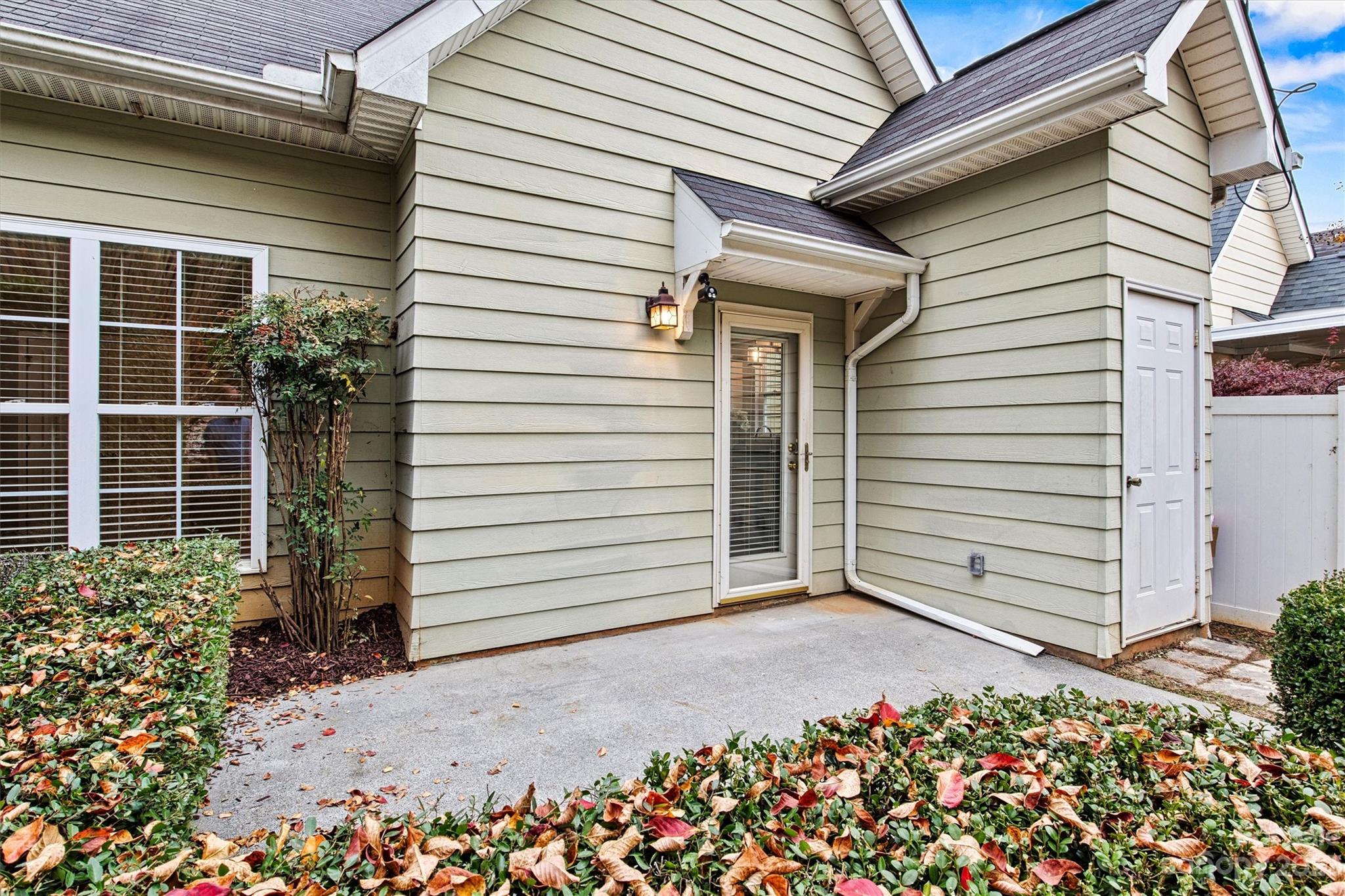 241 Faust Road Davidson, NC 28036 - Photo 25 of 29 a view of a house with a garage