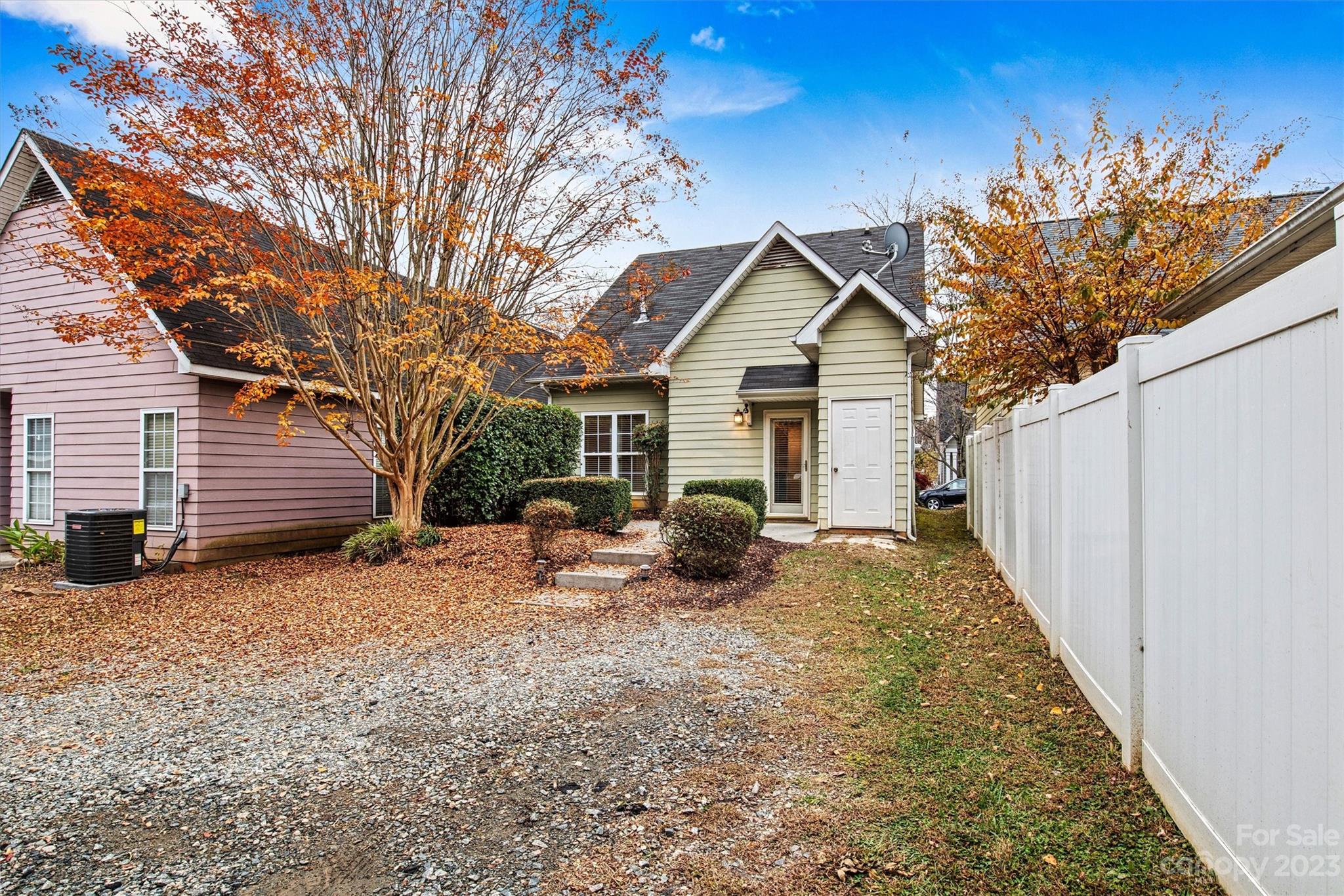 241 Faust Road Davidson, NC 28036 - Photo 27 of 29 a view of backyard with a table and chairs and wooden fence