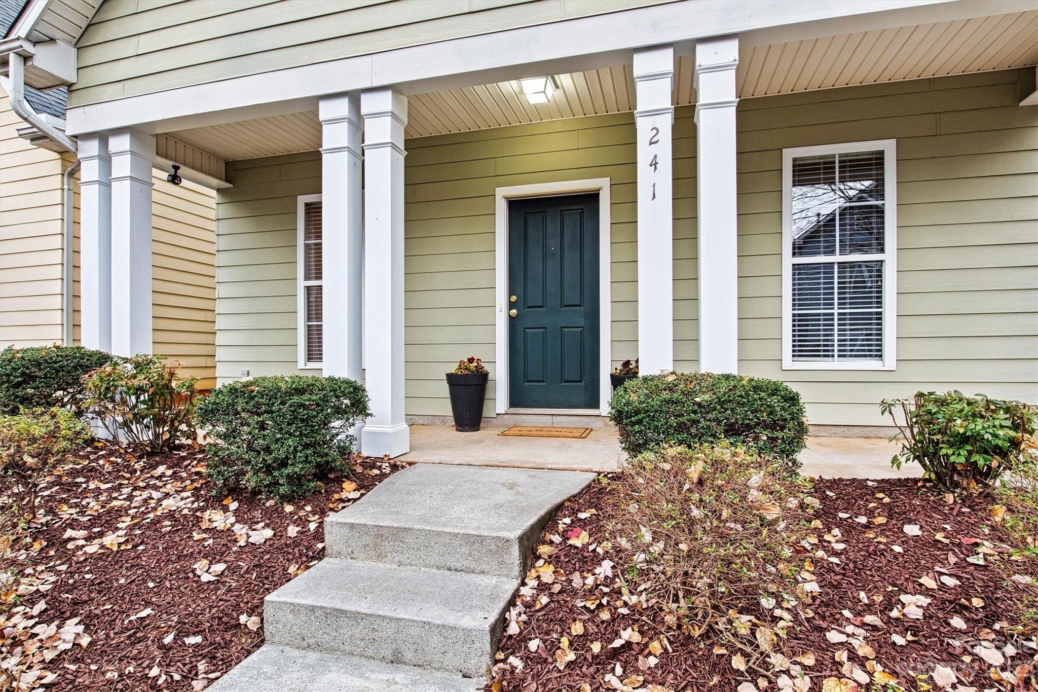 241 Faust Road Davidson, NC 28036 - Photo 3 of 29 a front view of a house with garden
