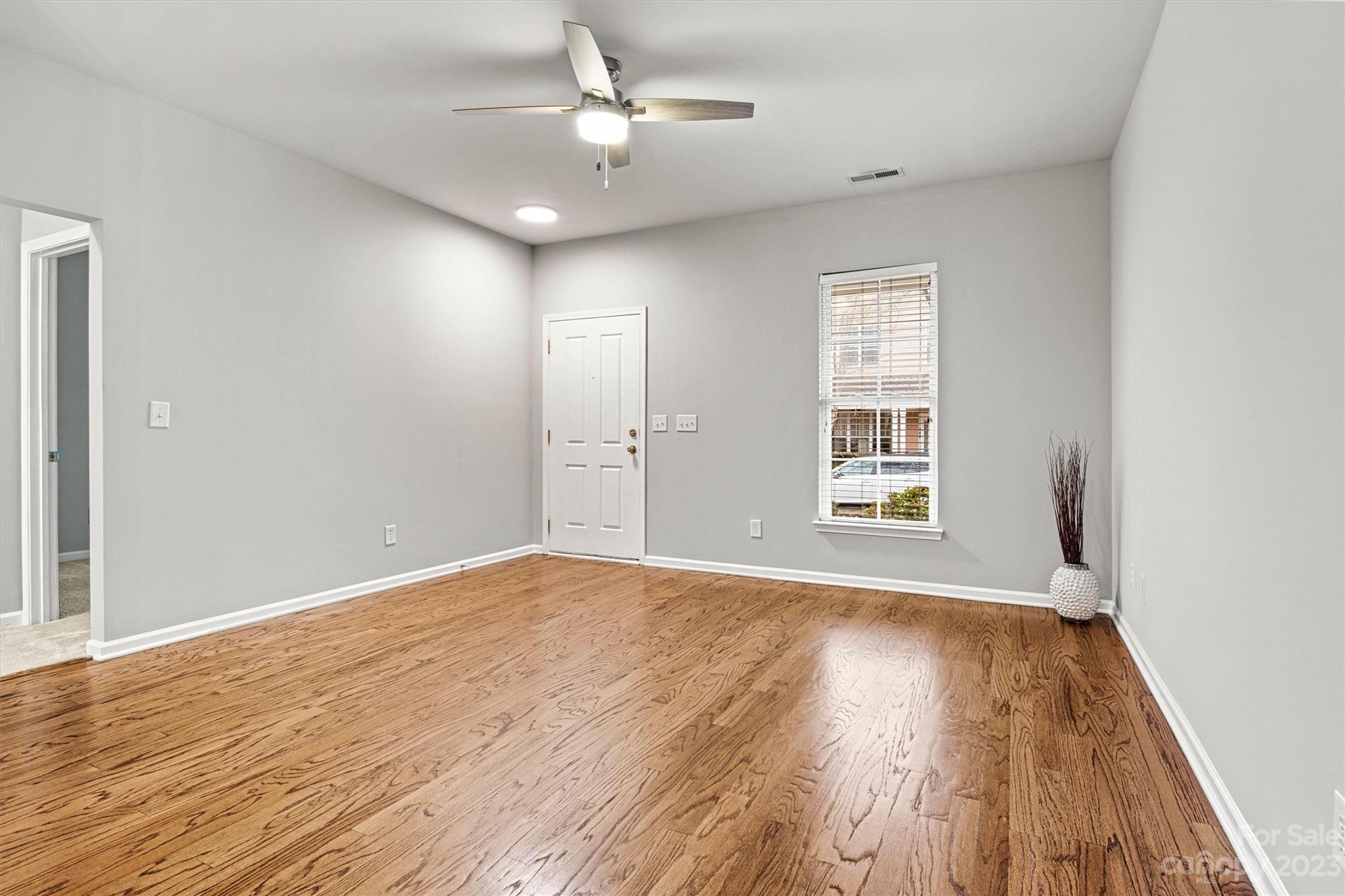 241 Faust Road Davidson, NC 28036 - Photo 6 of 29 wooden floor in an empty room with a window