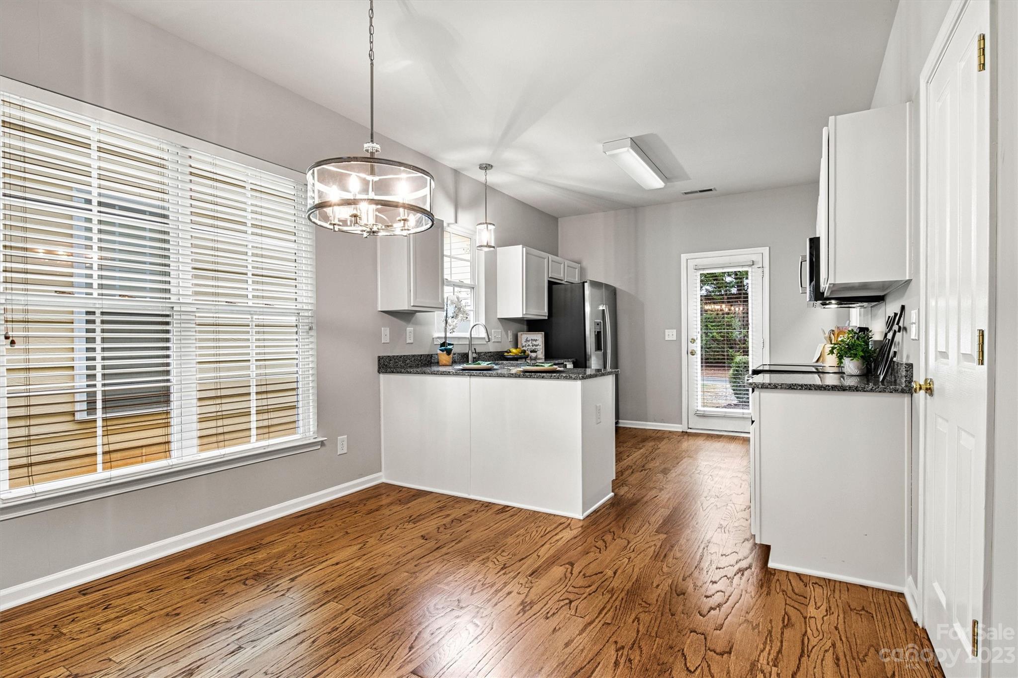 241 Faust Road Davidson, NC 28036 - Photo 7 of 29 a view of a kitchen with microwave and cabinets