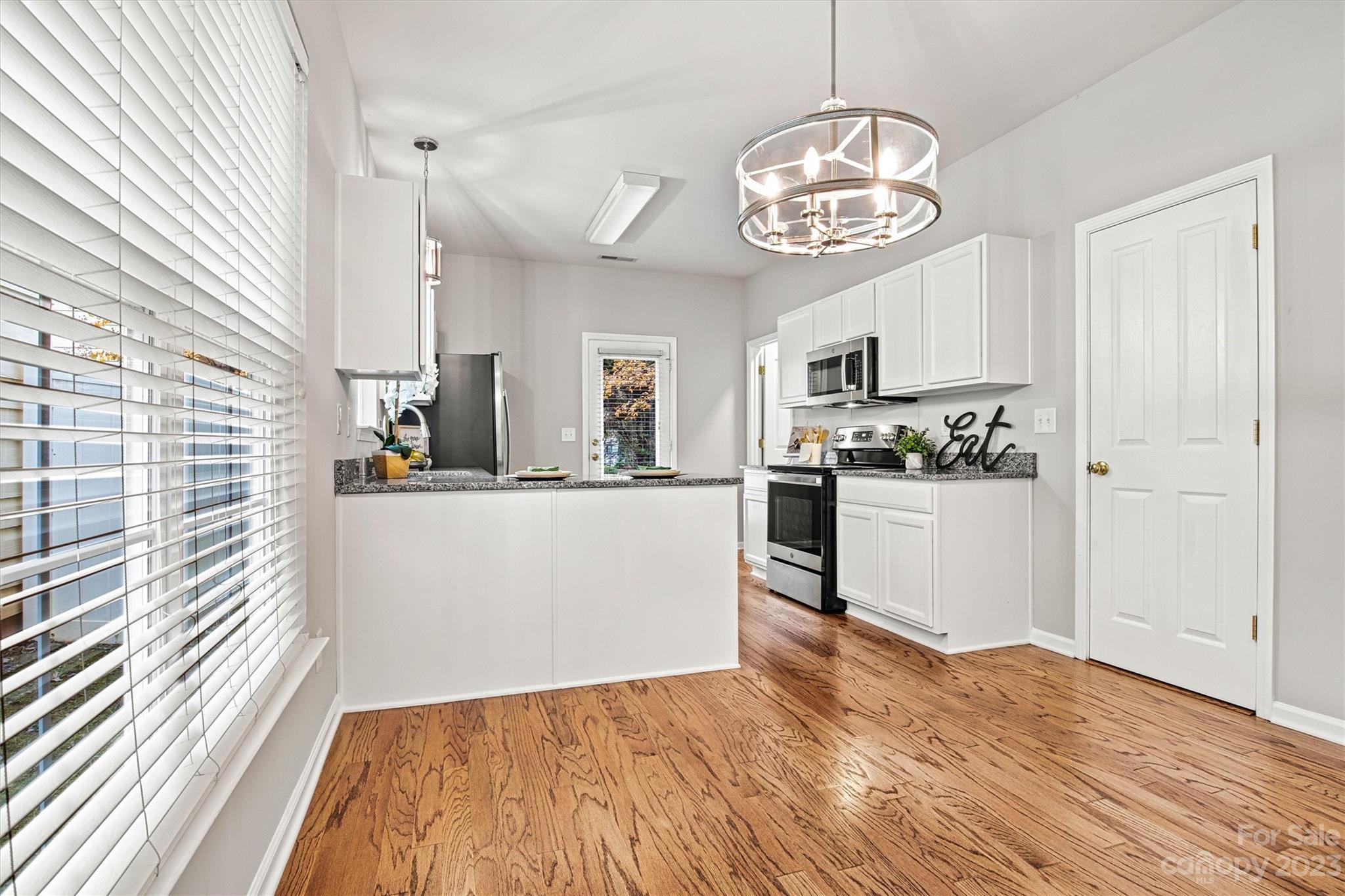 241 Faust Road Davidson, NC 28036 - Photo 8 of 29 a view of kitchen with sink and refrigerator