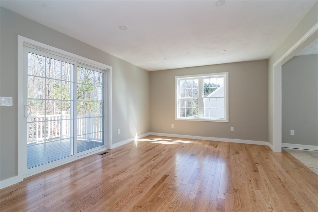 41 Martin Road Douglas, MA 01516 - Photo 23 of 40 a view of an empty room with wooden floor and a window
