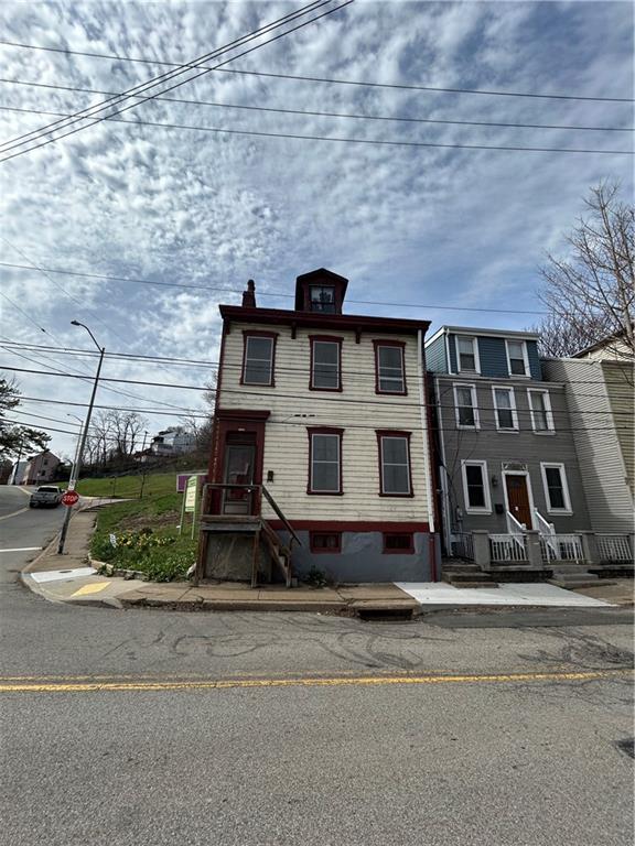 1000 Spring Garden Avenue Pittsburgh, PA 15212 - Photo 16 of 17 a front view of a house with a yard