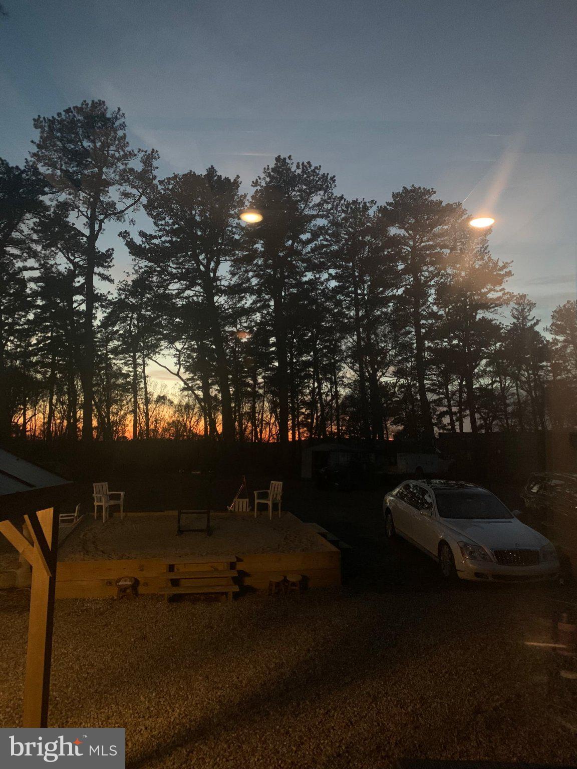 0 Cummins Hill Road Matamoras, PA 18336 - Photo 110 of 116 Serene sunset behind tall pines.