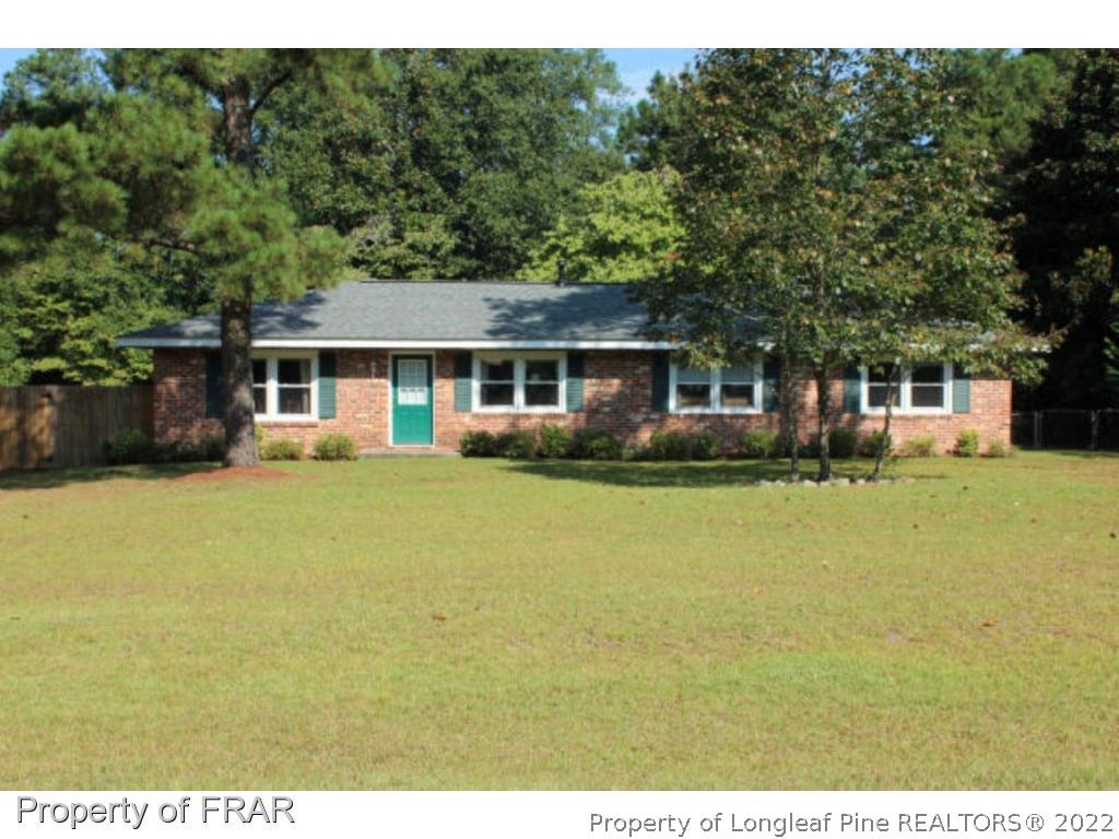 148 Ashemont Road Aberdeen, NC 28315 - Photo 1 of 18 a front view of house with yard and green space