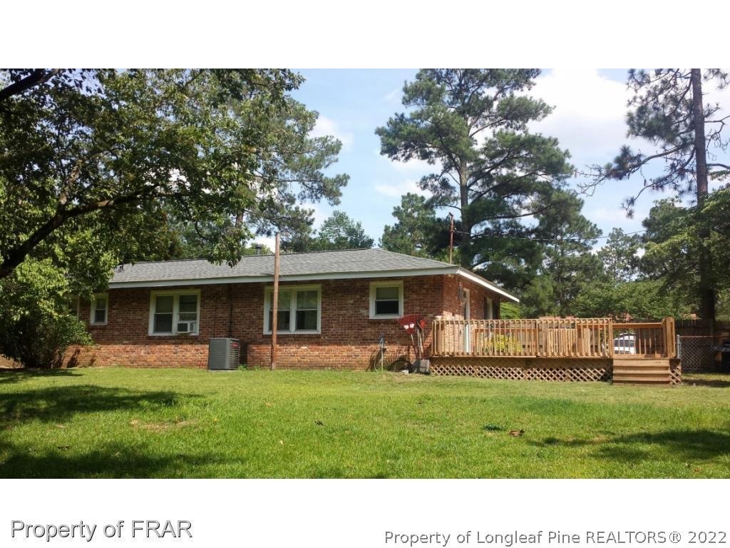 148 Ashemont Road Aberdeen, NC 28315 - Photo 15 of 18 a front view of house with yard and green space