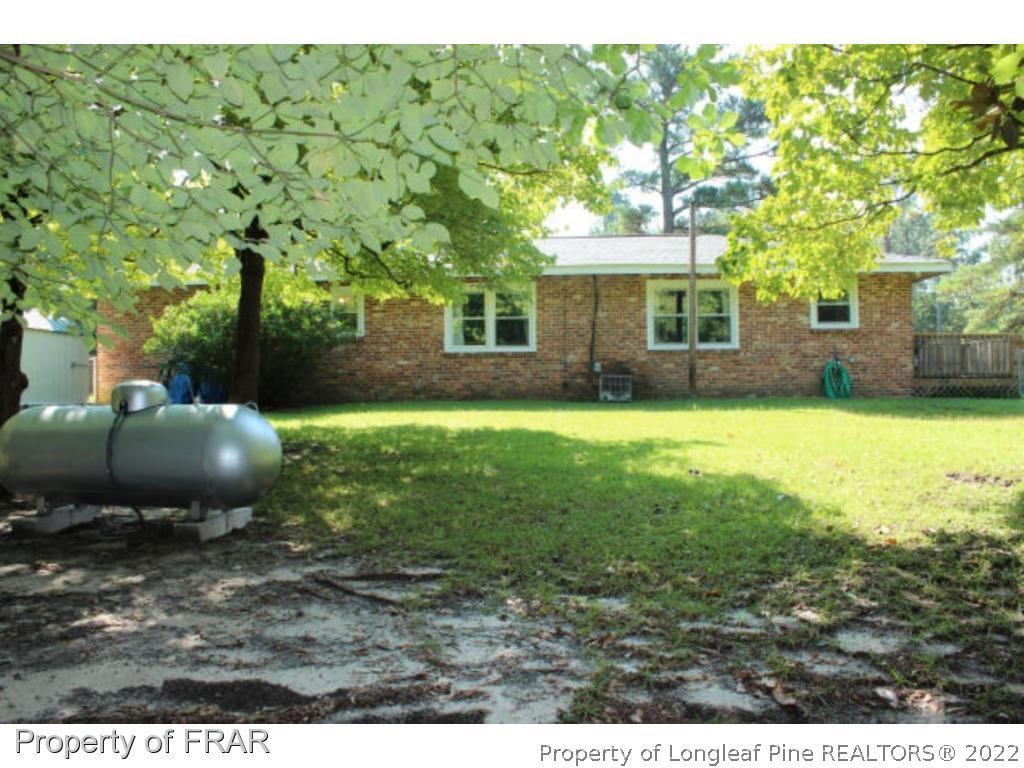 148 Ashemont Road Aberdeen, NC 28315 - Photo 16 of 18 a view of a backyard with a garden