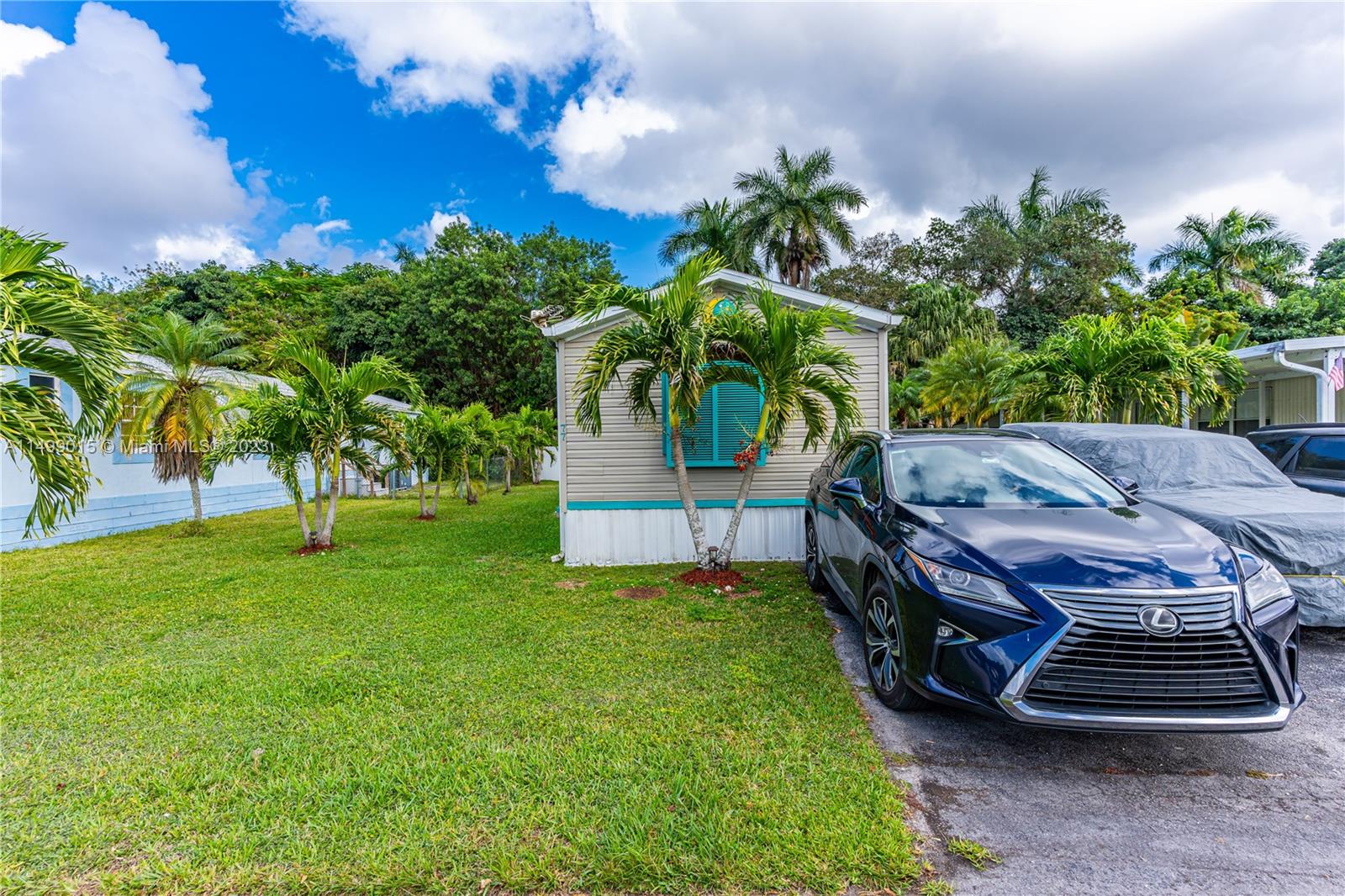 35250 Southwest 177th Court, Unit 77 Homestead, FL 33034 - Photo 2 of 30 a view of outdoor space yard and patio