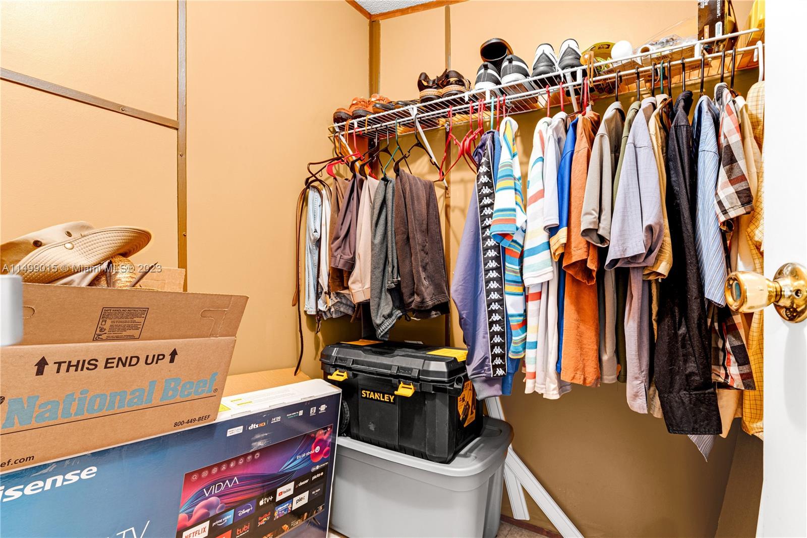 35250 Southwest 177th Court, Unit 77 Homestead, FL 33034 - Photo 21 of 30 a view of walk in closet with clothes and shoes