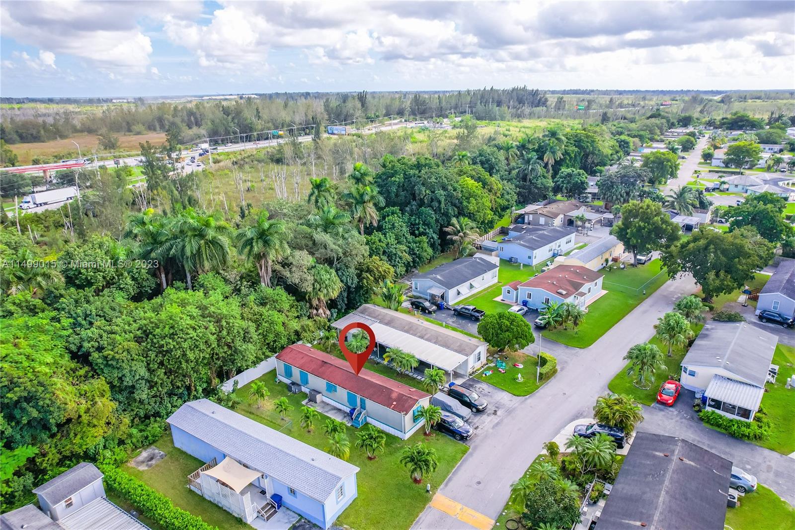 35250 Southwest 177th Court, Unit 77 Homestead, FL 33034 - Photo 25 of 30 a view of a city with lots of trees and houses in the background