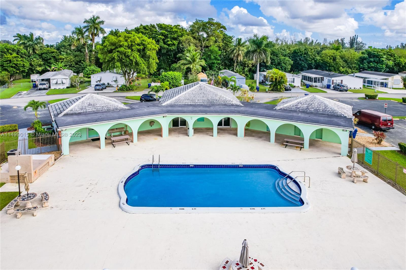 35250 Southwest 177th Court, Unit 77 Homestead, FL 33034 - Photo 27 of 30 a view of swimming pool with outdoor seating