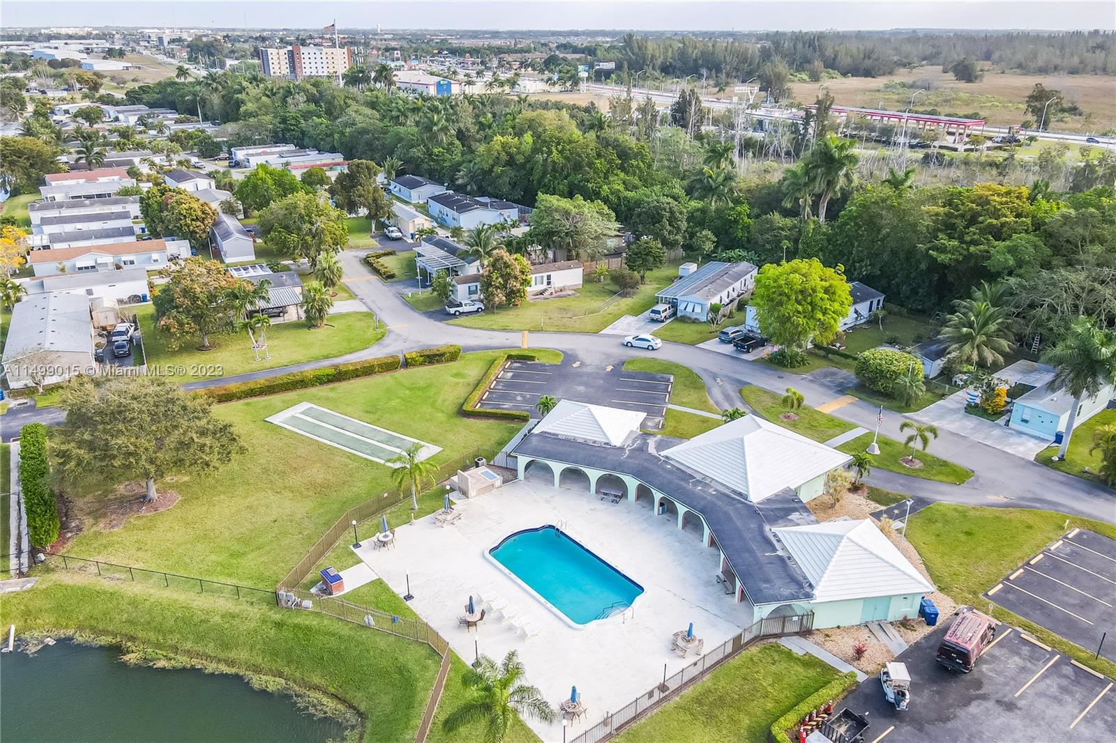 35250 Southwest 177th Court, Unit 77 Homestead, FL 33034 - Photo 28 of 30 an aerial view of a swimming pool patio and mountain view