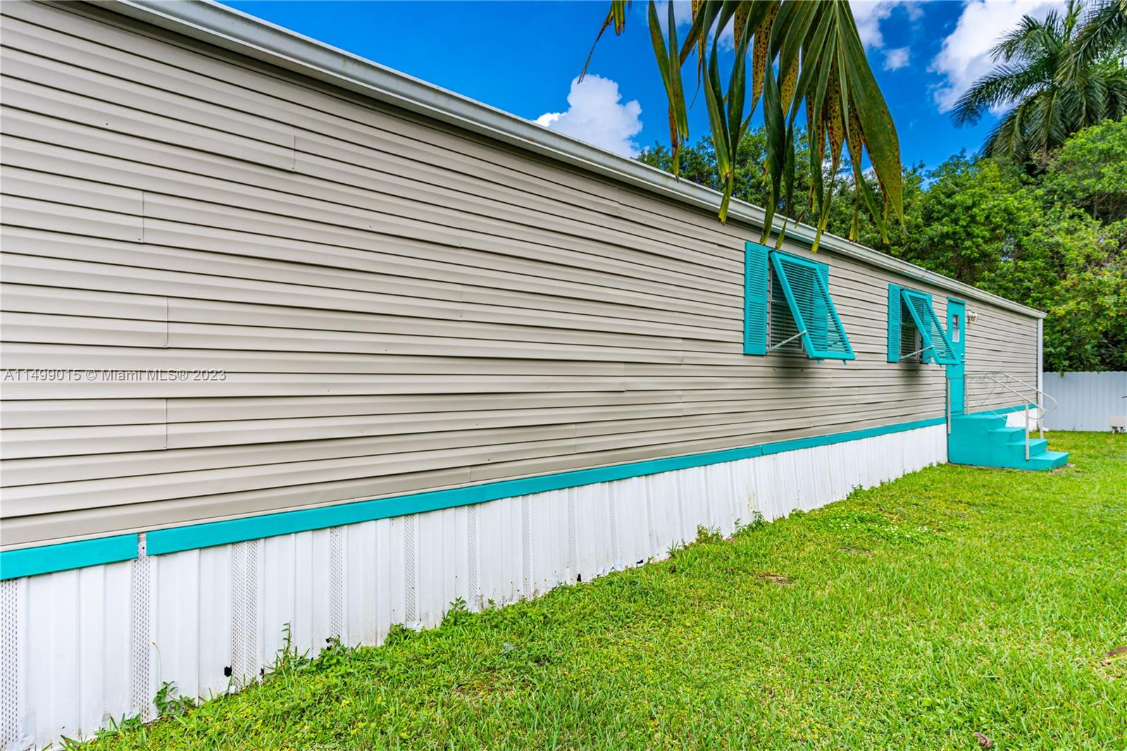 35250 Southwest 177th Court, Unit 77 Homestead, FL 33034 - Photo 3 of 30 a view of a back yard of the house