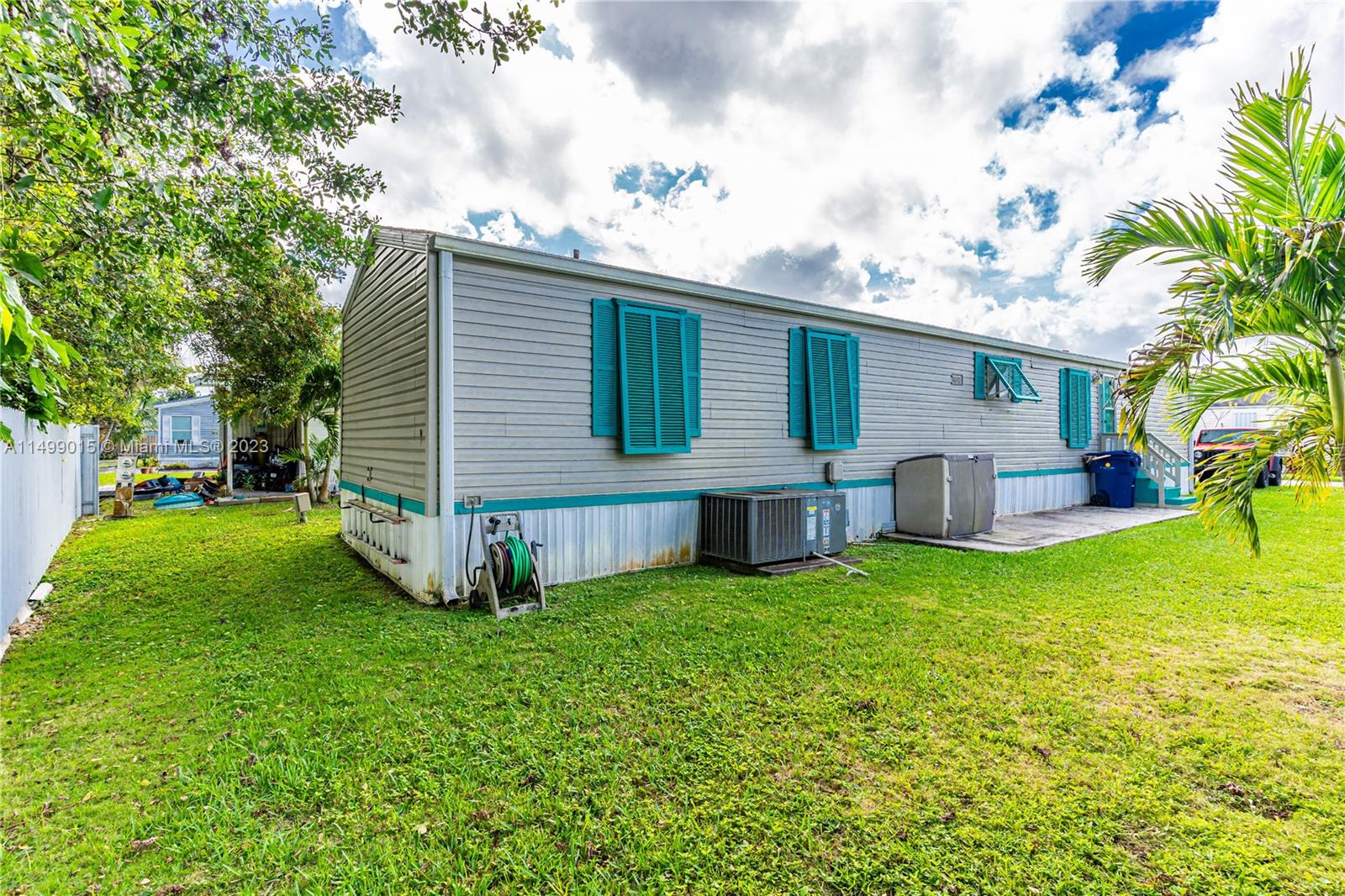 35250 Southwest 177th Court, Unit 77 Homestead, FL 33034 - Photo 4 of 30 a view of a house with a backyard