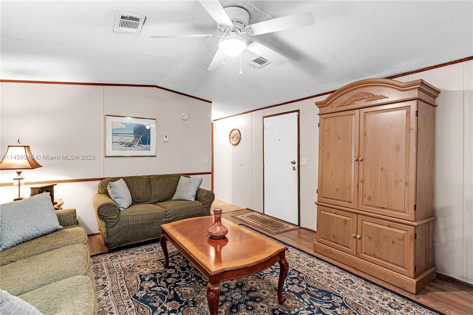 35250 Southwest 177th Court, Unit 77 Homestead, FL 33034 - Photo 9 of 30 a living room with furniture and a rug