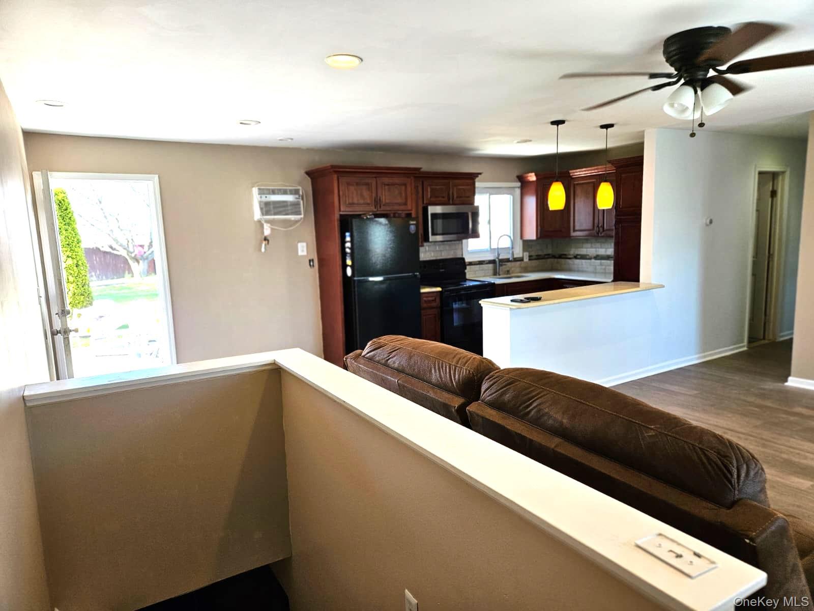 56 Applegate Drive Central Islip, NY 11722 - Photo 19 of 33 a kitchen with stainless steel appliances granite countertop a refrigerator a sink and a stove