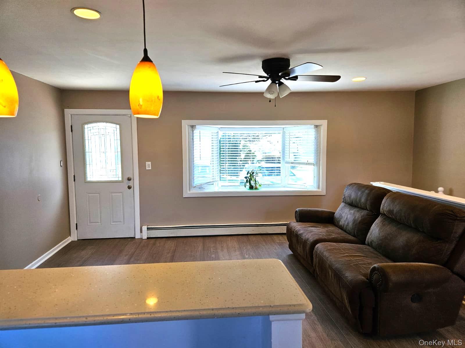 56 Applegate Drive Central Islip, NY 11722 - Photo 24 of 33 a living room with furniture and a window