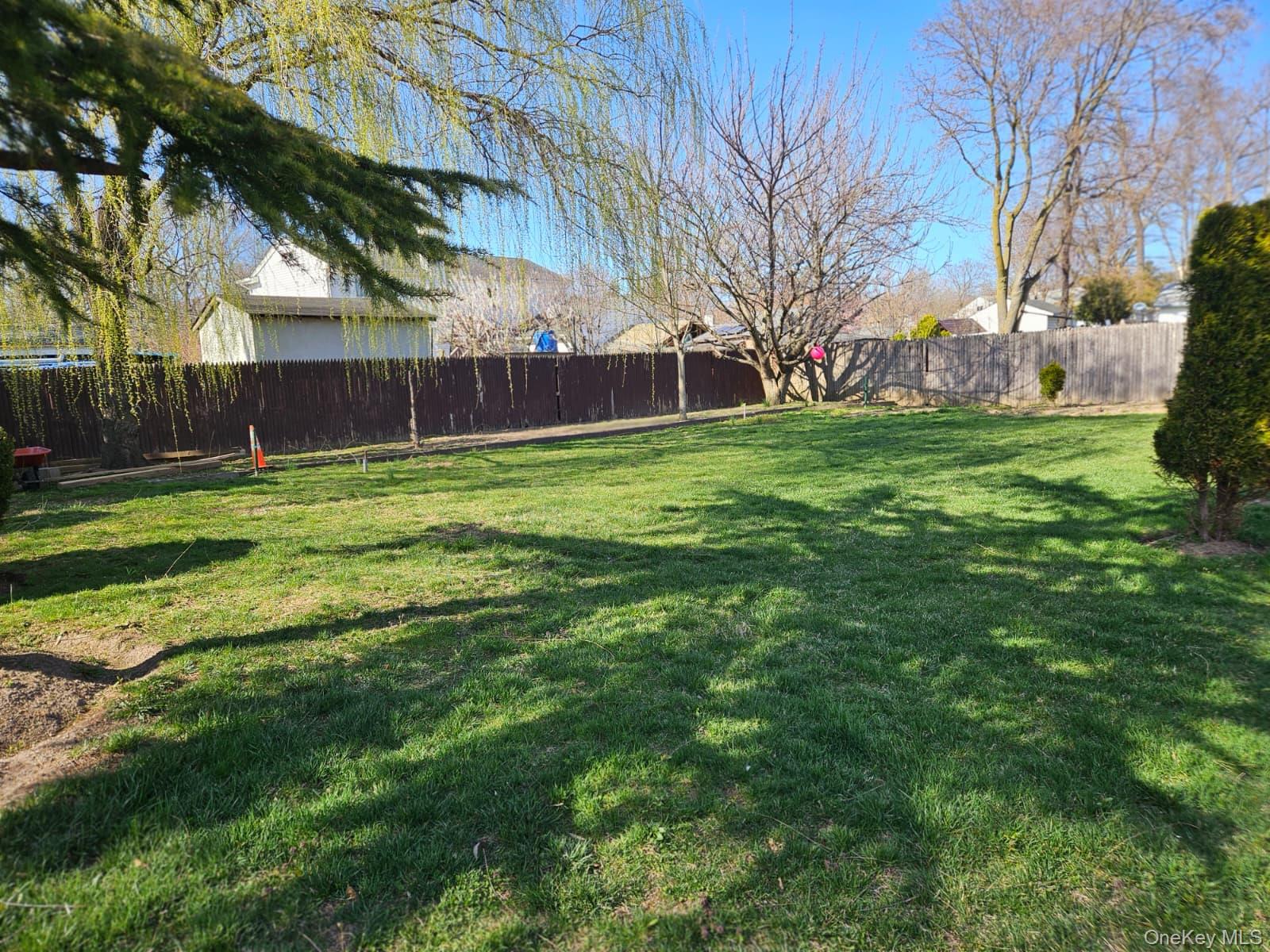 56 Applegate Drive Central Islip, NY 11722 - Photo 27 of 33 a fire hydrant in the middle of a field