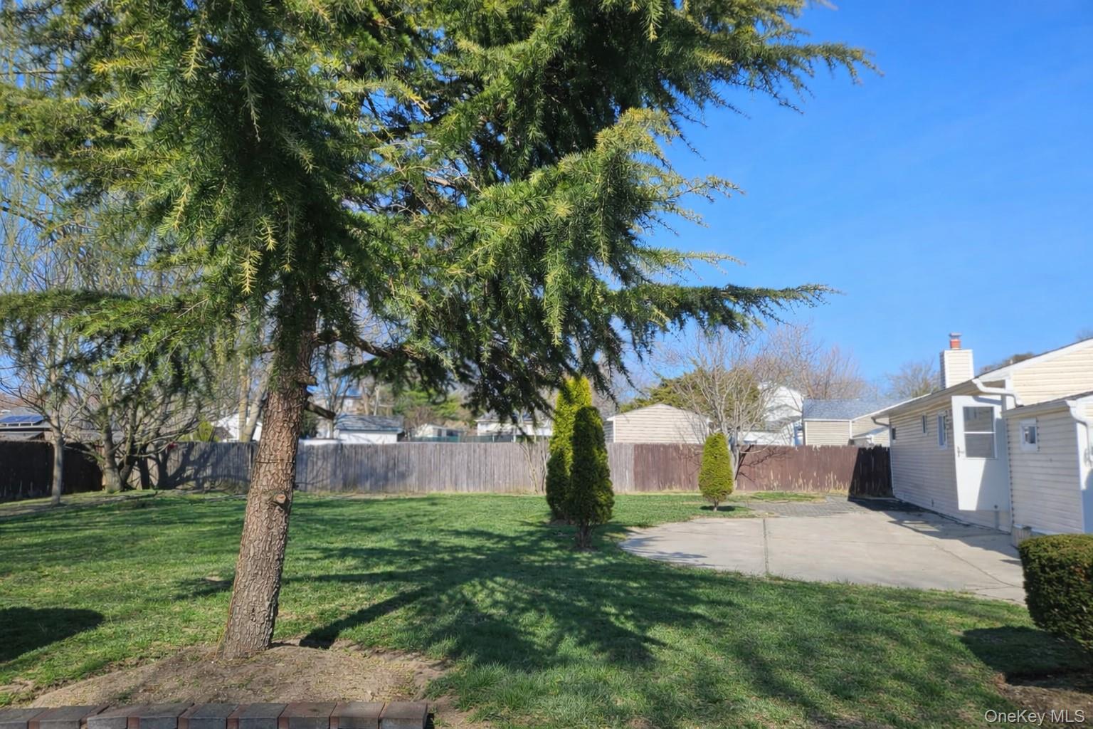 56 Applegate Drive Central Islip, NY 11722 - Photo 29 of 33 a view of a yard with a house