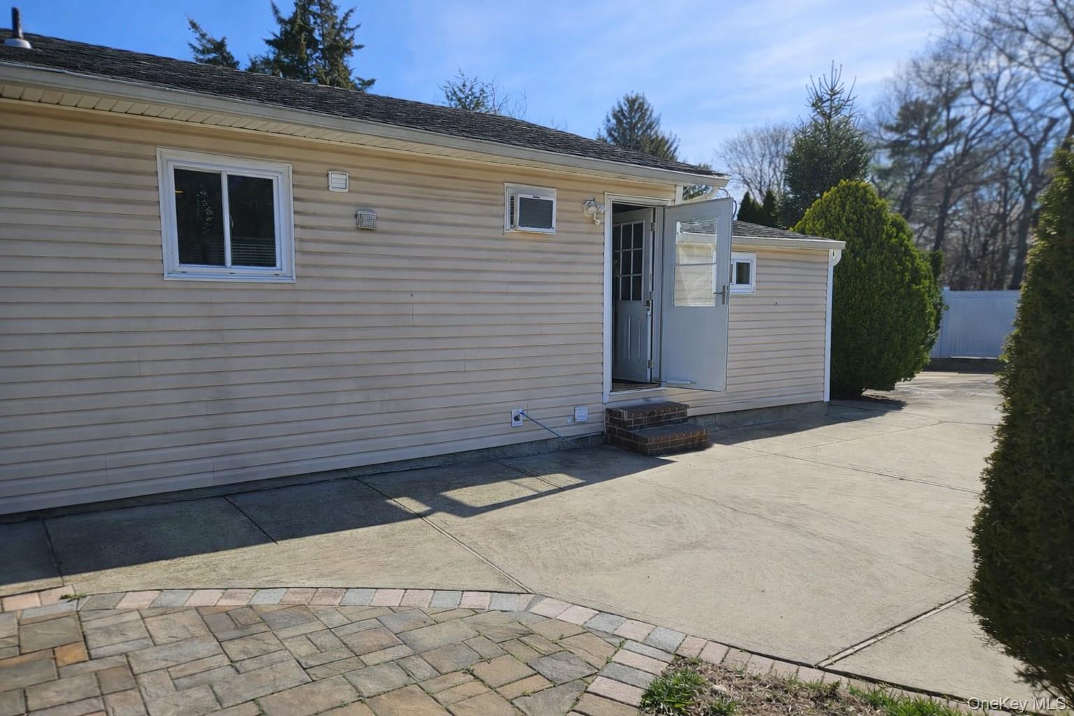 56 Applegate Drive Central Islip, NY 11722 - Photo 32 of 33 a side view of a house