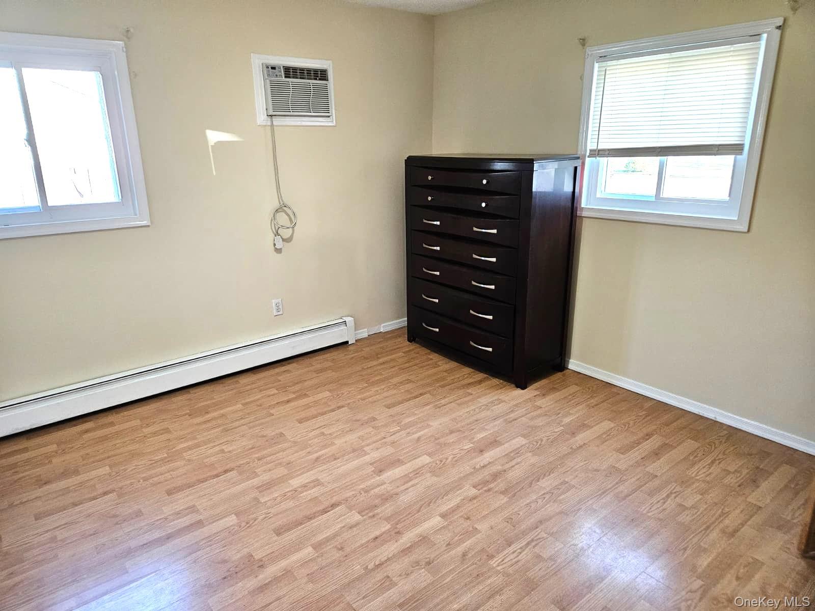 56 Applegate Drive Central Islip, NY 11722 - Photo 4 of 33 wooden floor and window in a room