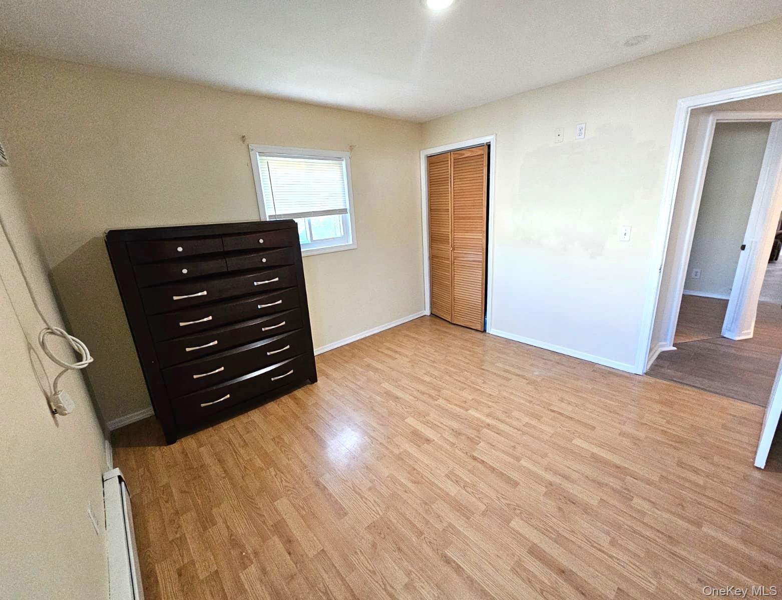 56 Applegate Drive Central Islip, NY 11722 - Photo 6 of 33 wooden floor and window in a room