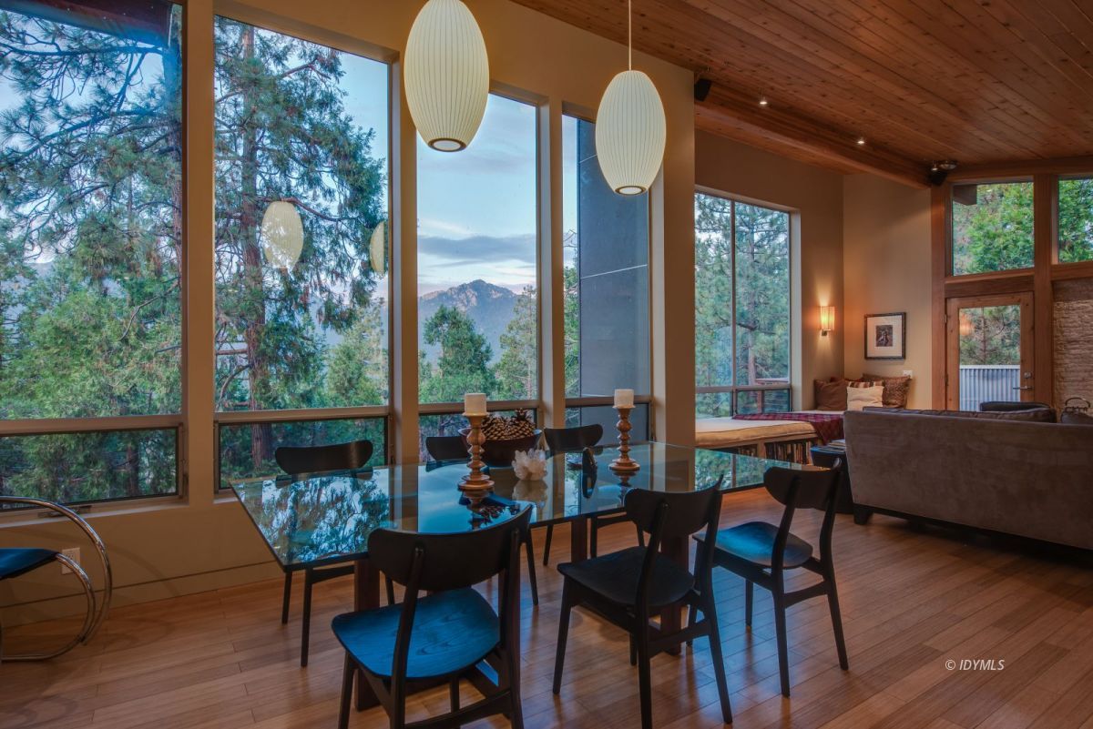 52522 Double View Drive Idyllwild, CA 92549 - Photo 20 of 72 a view of a dining room with furniture window and wooden floor