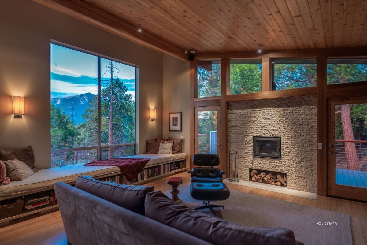 52522 Double View Drive Idyllwild, CA 92549 - Photo 21 of 72 a living room with furniture a flat screen tv and a fireplace
