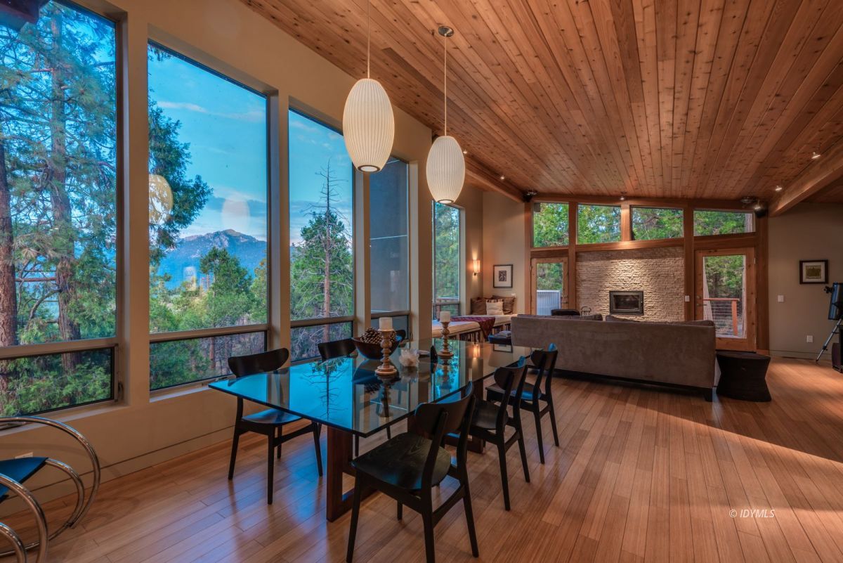 52522 Double View Drive Idyllwild, CA 92549 - Photo 23 of 72 a dining room with furniture a chandelier and wooden floor