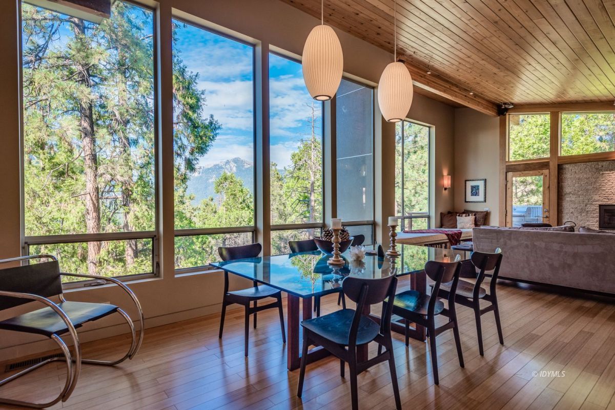 52522 Double View Drive Idyllwild, CA 92549 - Photo 29 of 72 a view of a dining room with furniture window and wooden floor