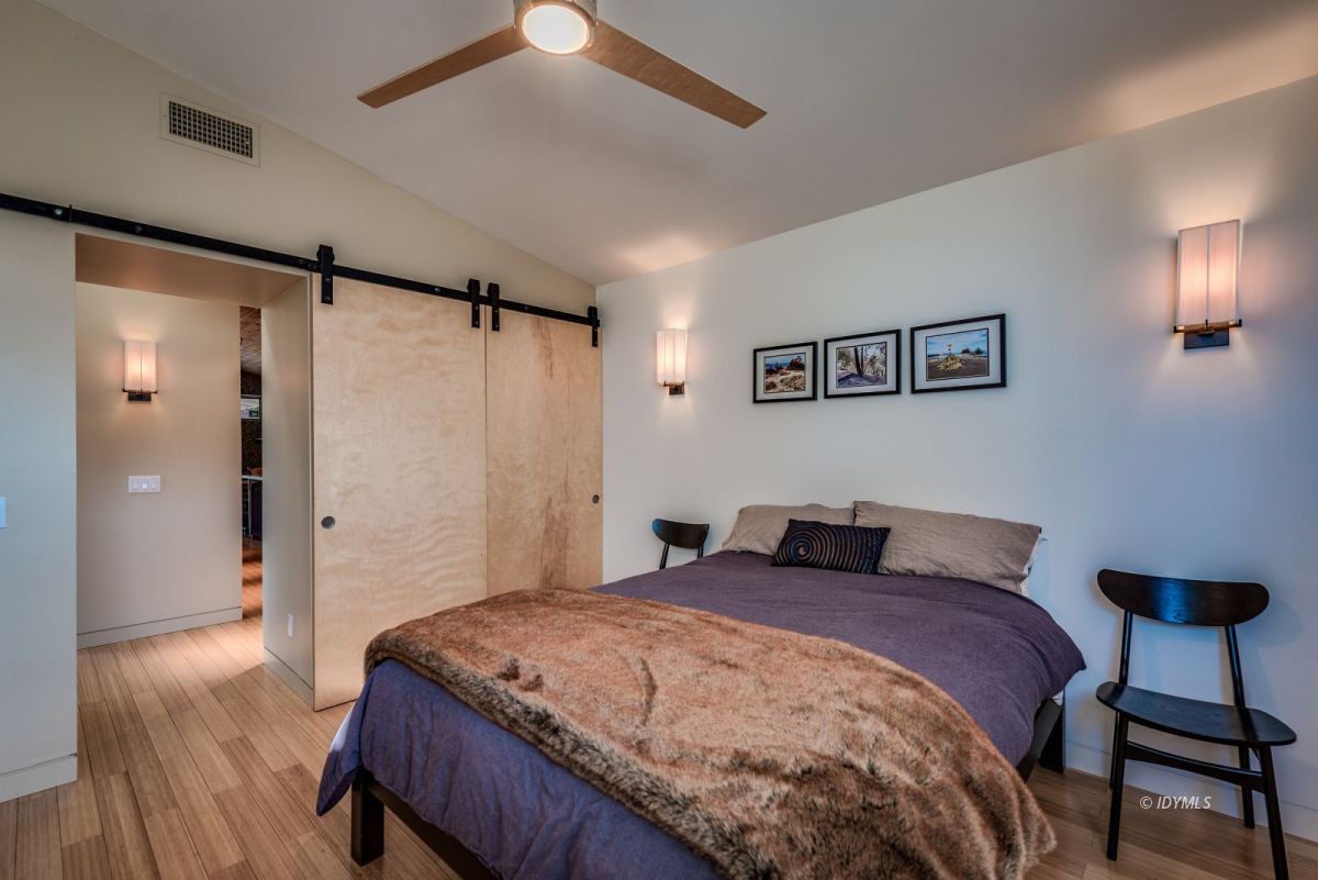 52522 Double View Drive Idyllwild, CA 92549 - Photo 41 of 72 a bedroom with a bed and a chandelier