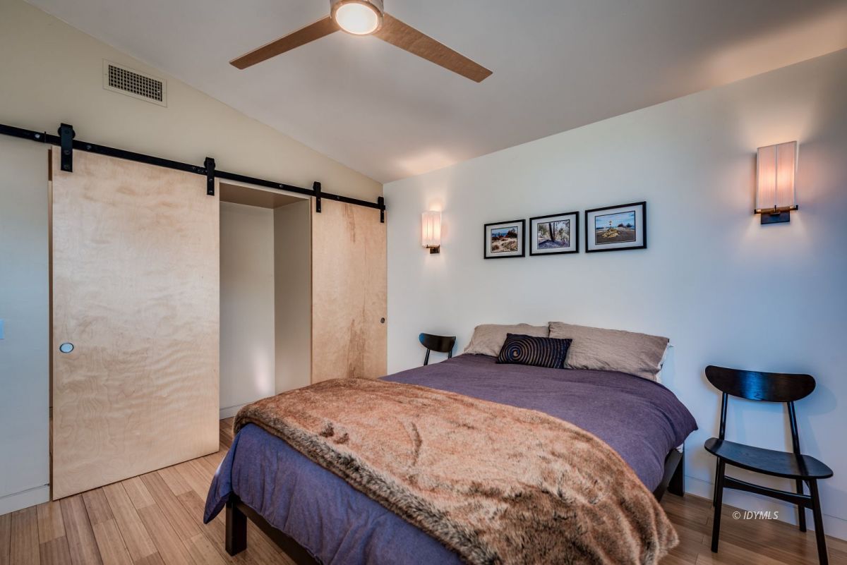 52522 Double View Drive Idyllwild, CA 92549 - Photo 42 of 72 a bedroom with a bed and a chandelier