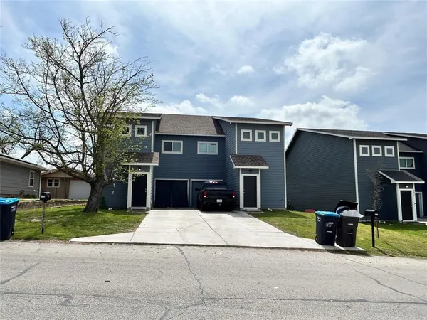 a view of house with yard